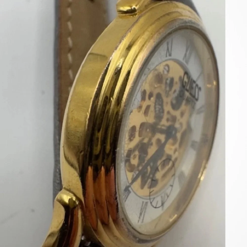 Guess Gold and Silver Quartz skeleton watch